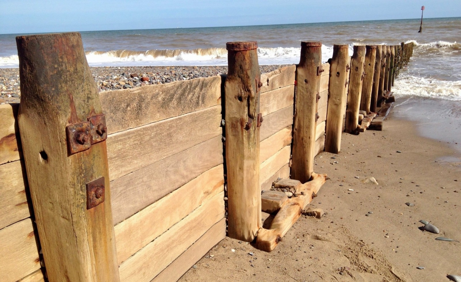 Groynes trapping sand transported by longshore drift at Hornsea on the Holderness Coast.