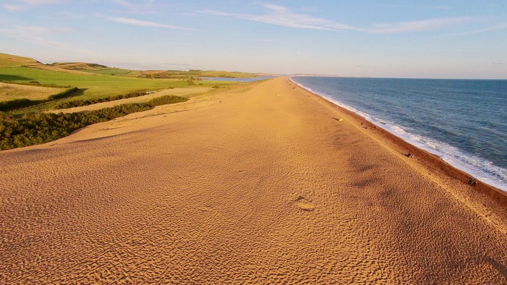 Aerial image of Chesil Beach Chesil Bank, 29 km long shingle beach, a  tombolo connecting mainland to the Isle of Portland, Jurassic Coast, UNESCO  Worl - SuperStock