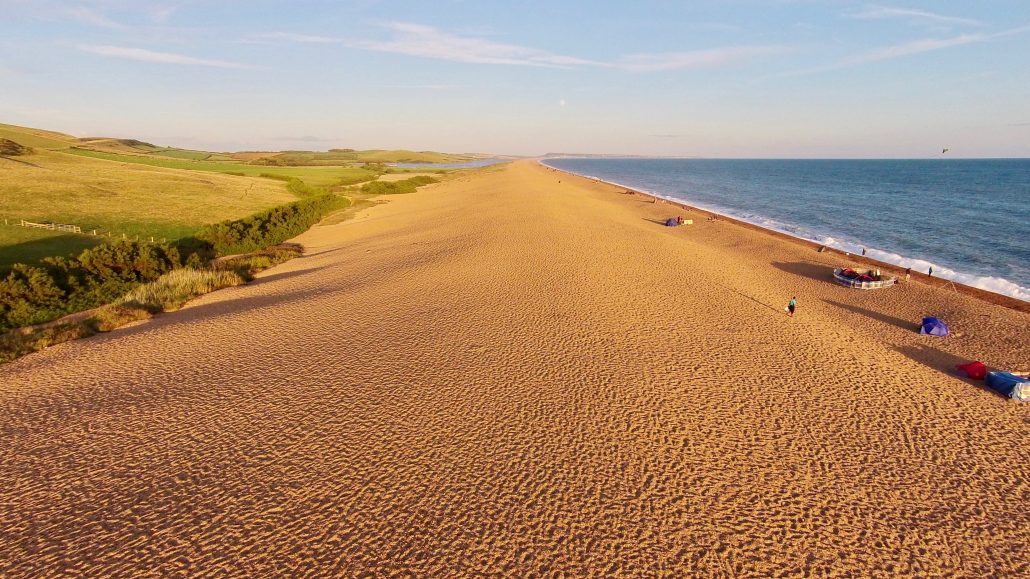 Aerial image of Chesil Beach Chesil Bank, 29 km long shingle beach, a  tombolo connecting mainland to the Isle of Portland, Jurassic Coast, UNESCO  Worl - SuperStock