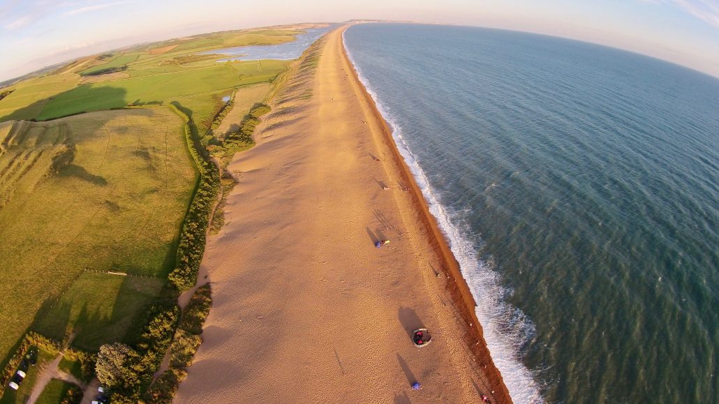 Aerial image of Chesil Beach Chesil Bank, 29 km long shingle beach, a  tombolo connecting mainland to the Isle of Portland, Jurassic Coast, UNESCO  Worl - SuperStock