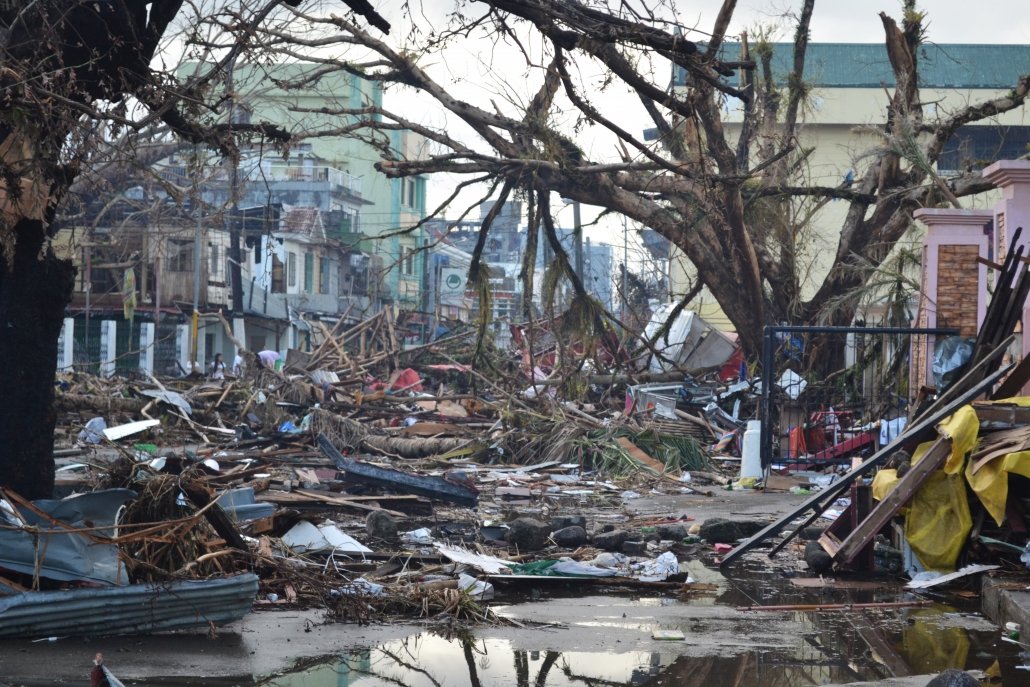 Debris lines the streets of Tacloban, Leyte island. This region was the worst affected by the typhoon, causing widespread damage and loss of life. Caritas is responding by distributing food, shelter, hygiene kits and cooking utensils. (Photo: Eoghan Rice - Trócaire / Caritas)