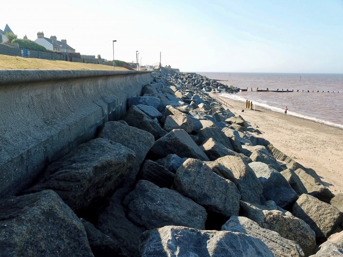 Recurved sea wall, rock armour and groynes at Withernsea