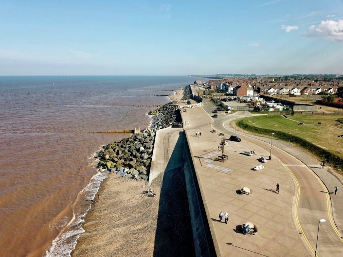 Rock armour and groynes at Withernsea - view south