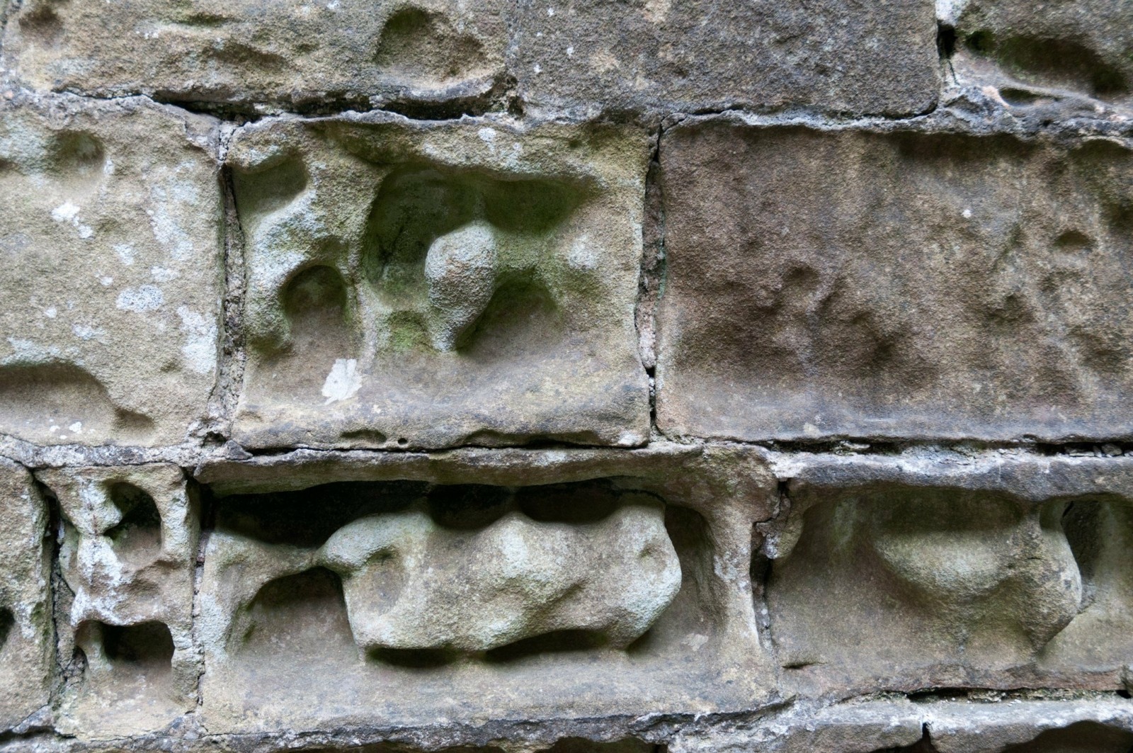 Limestone bricks weathered by acidic rain