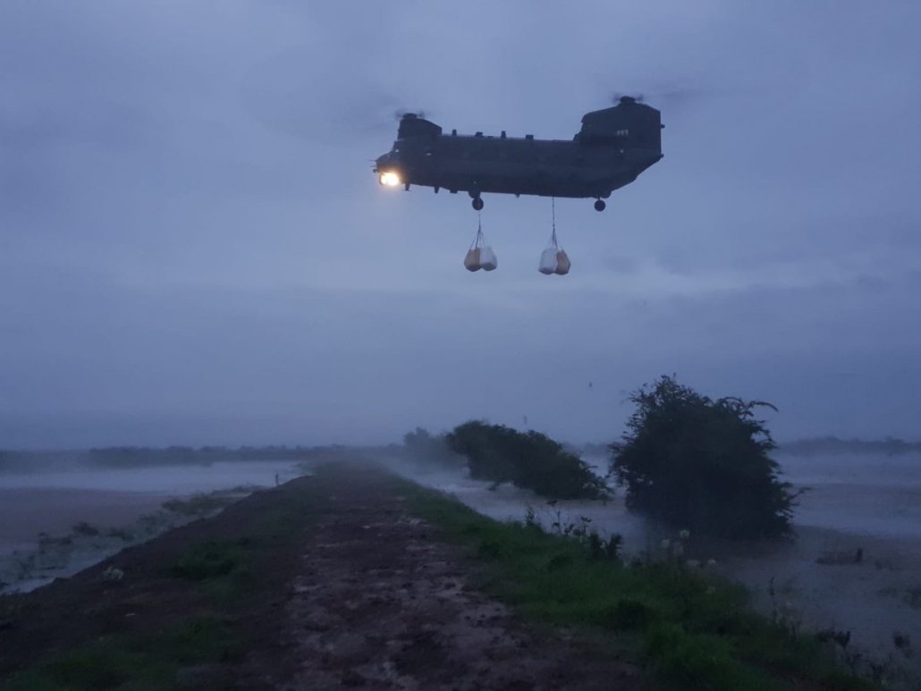 Chinook helicopter dropping 1 tonne bags of balast