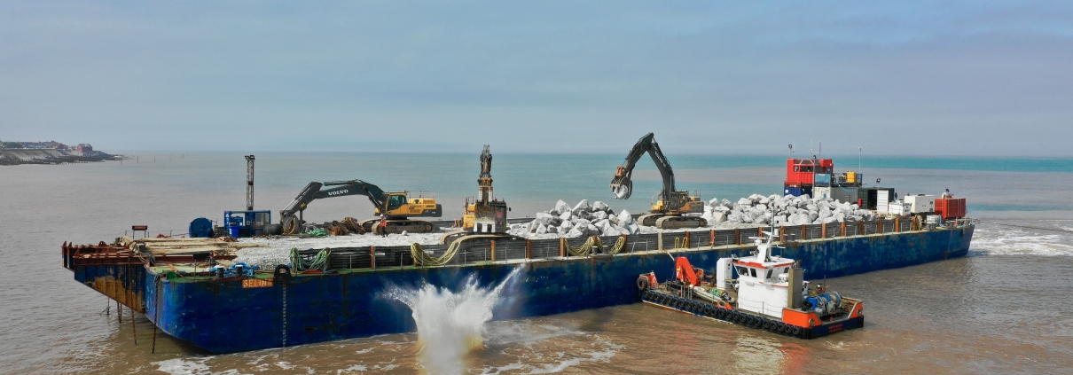 Rock being dropped from a barge