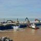 Rock being dropped from a barge