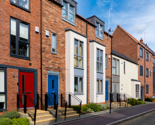 An image of two and three storey new build housing in Hornsea Quarter, Fruit Market.