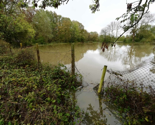 Flooded public footpath and farmland in Horley, Surrey on November 2nd 2023 after Storm Ciaran