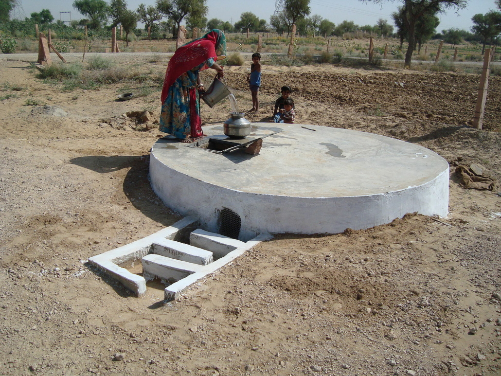 A villager collects water from a taanka in the That Desert